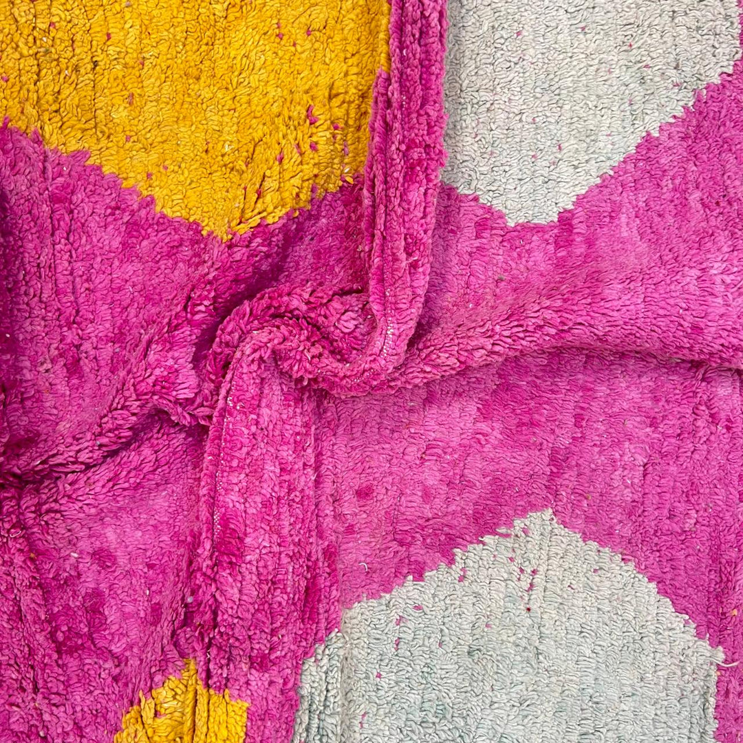 Vintage Moroccan wool rug 141 – handmade geometric pattern in pink, yellow, and blue tones (268 × 161 cm).