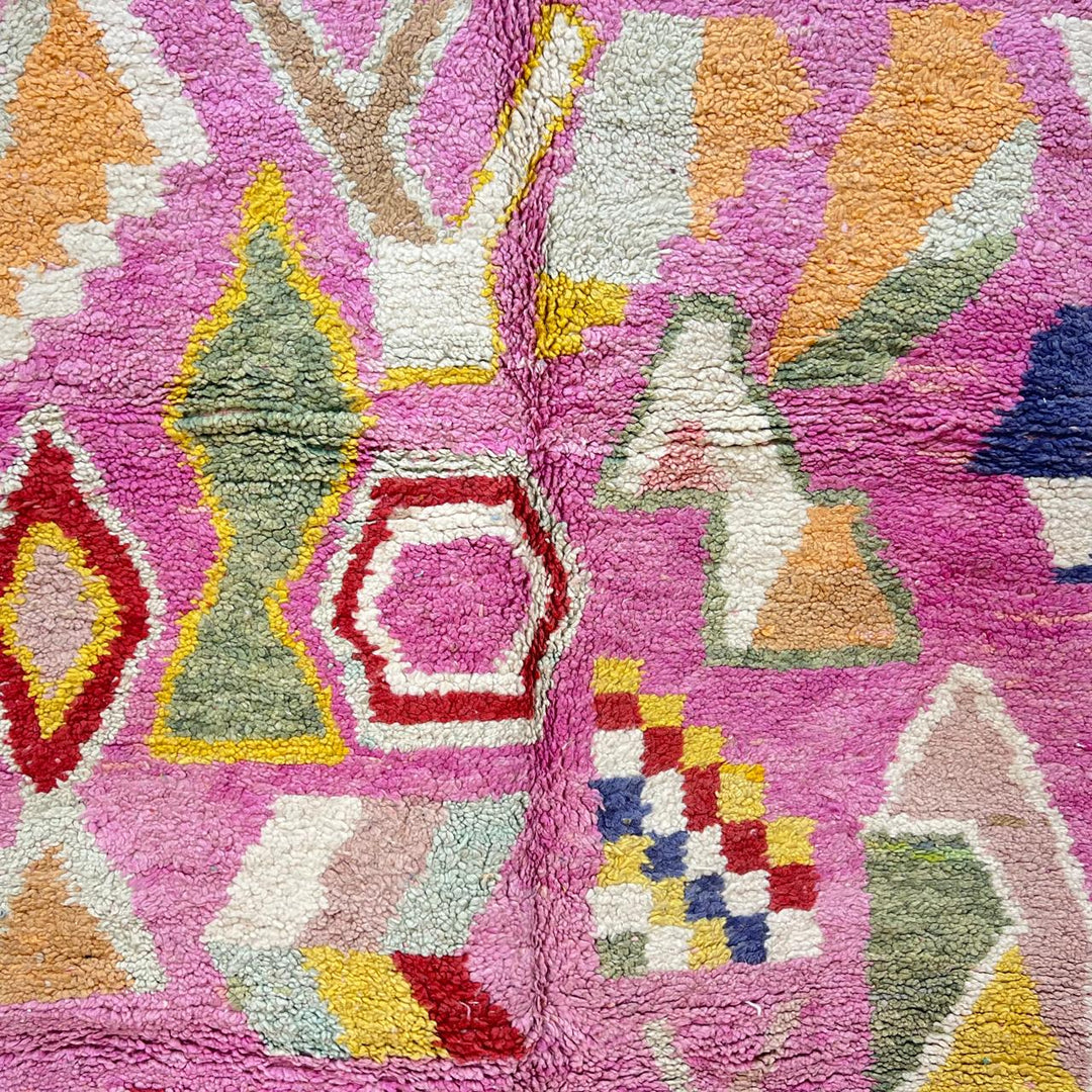 Vintage Moroccan wool rug 743 – handmade Berber carpet in pink with colorful geometric motifs in red, yellow, green, and blue, 268 × 144 cm (8.79 × 4.72 ft).