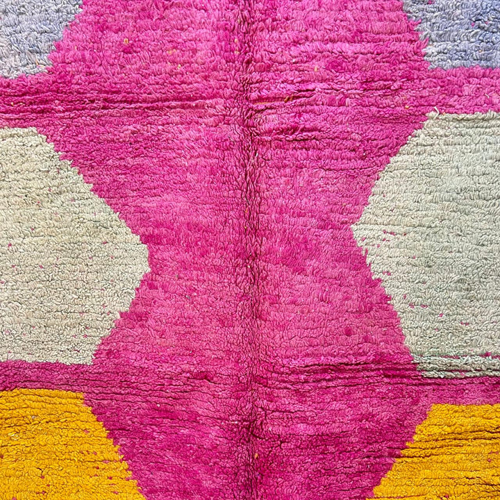 Vintage Moroccan wool rug 141 – handmade geometric pattern in pink, yellow, and blue tones (268 × 161 cm).