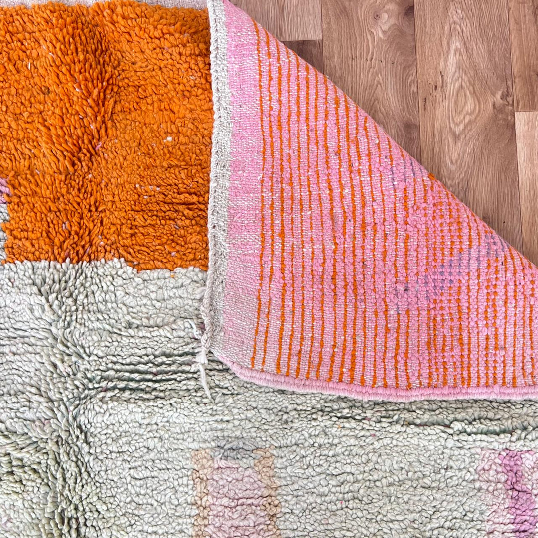 Vintage Moroccan wool rug 745 – handmade orange and pink Berber carpet with geometric diamond pattern (251 × 173 cm / 8.23 × 5.67 ft).