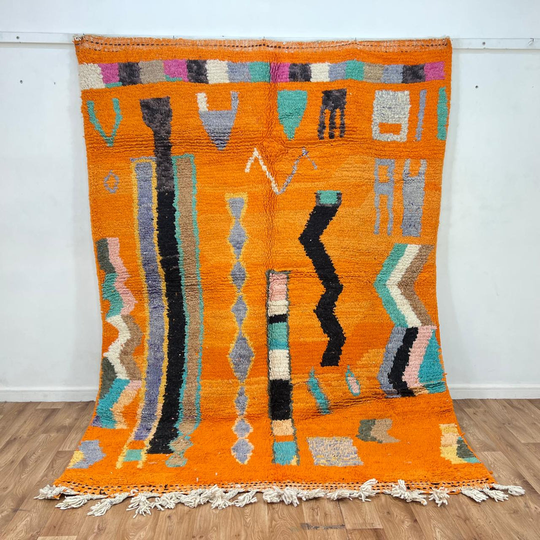 Vintage Moroccan wool rug 324 – handmade Berber carpet with bright orange base and multicolor geometric tribal design, 260 × 190 cm (8.53 × 6.23 ft).