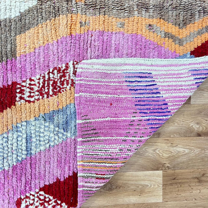 Vintage Moroccan wool rug 776 – colorful handmade Berber carpet with pink, red, and beige geometric patterns, 262 × 168 cm (8.59 × 5.51 ft).