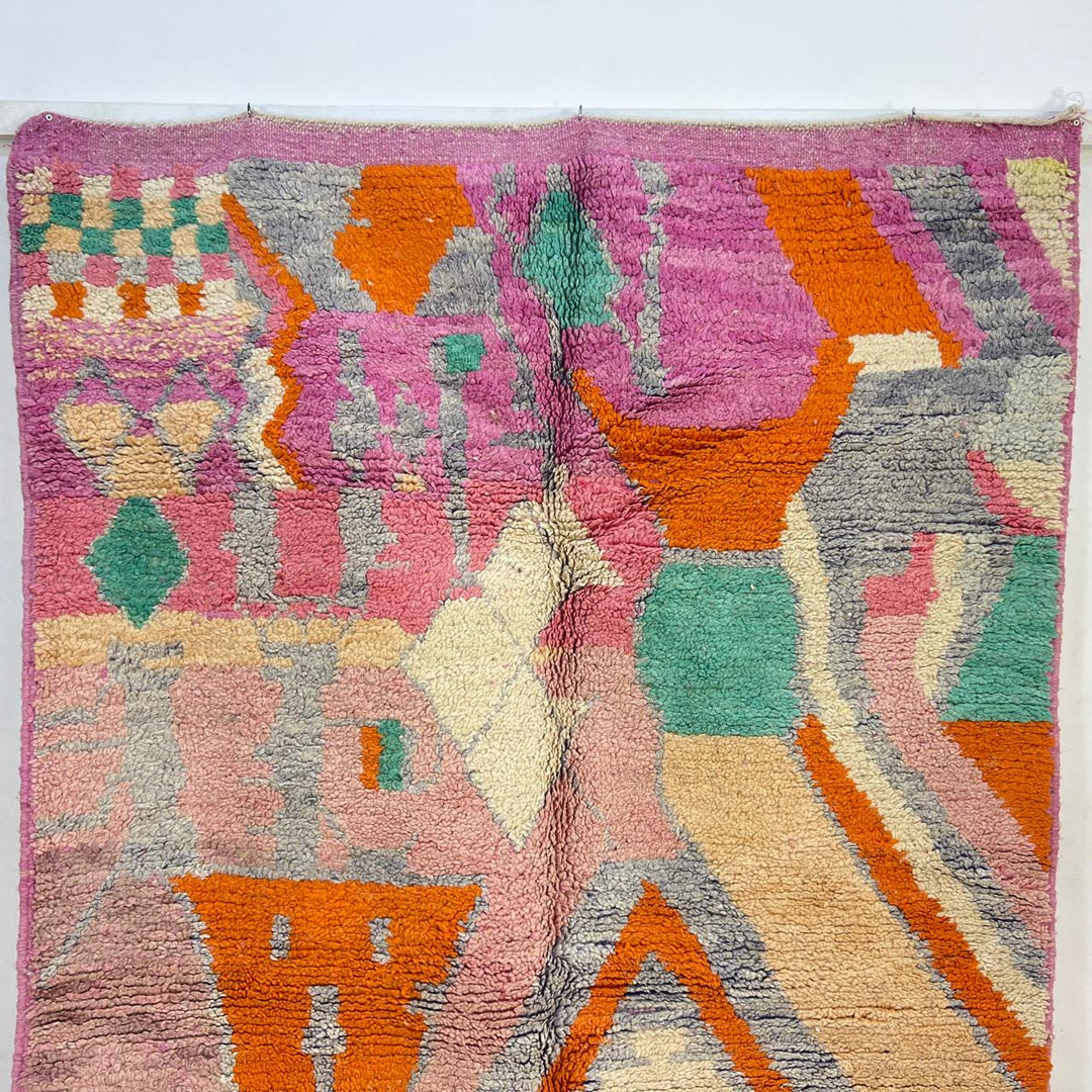 Vintage Moroccan wool rug in pink and orange tones with abstract Berber geometric patterns, handmade in Morocco