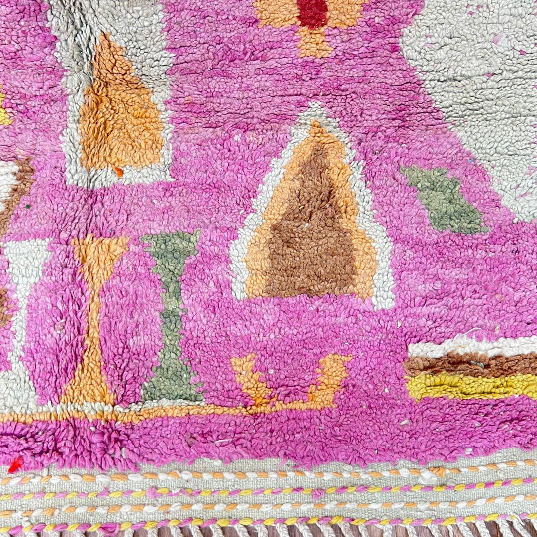 Vintage Moroccan wool rug 743 – handmade Berber carpet in pink with colorful geometric motifs in red, yellow, green, and blue, 268 × 144 cm (8.79 × 4.72 ft).