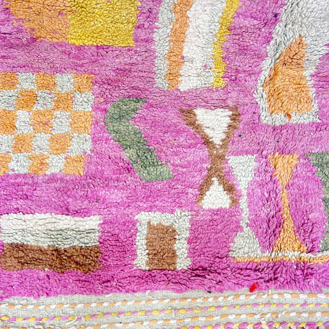 Vintage Moroccan wool rug 743 – handmade Berber carpet in pink with colorful geometric motifs in red, yellow, green, and blue, 268 × 144 cm (8.79 × 4.72 ft).