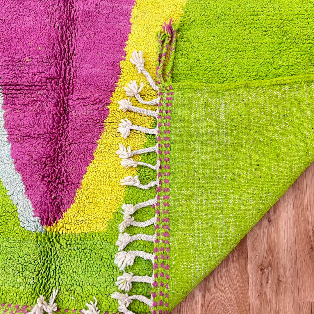 Vintage Moroccan wool rug 877 – handmade Berber carpet with lime green base and pink-yellow abstract stripe, 299 × 206 cm (9.81 × 6.75 ft).