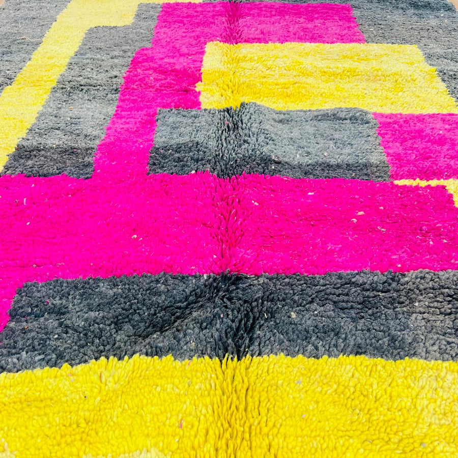 Vintage Moroccan wool rug with pink yellow and charcoal geometric pattern, handwoven Berber carpet from Morocco