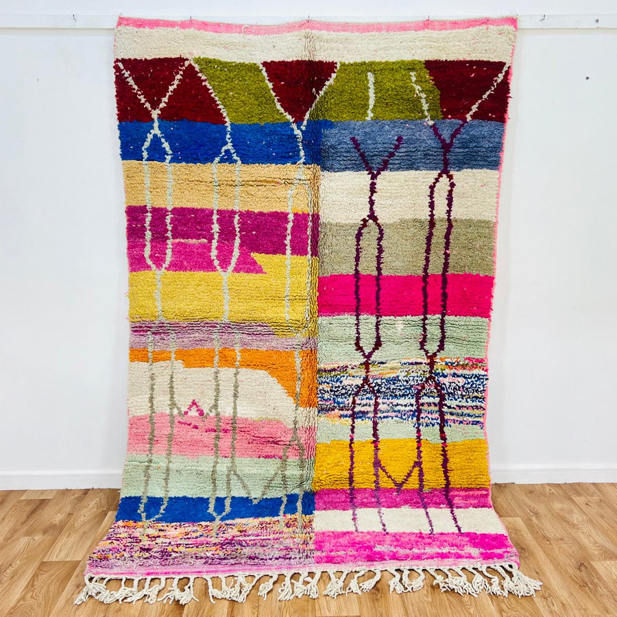 Vintage Moroccan Berber wool rug with colorful geometric patchwork pattern