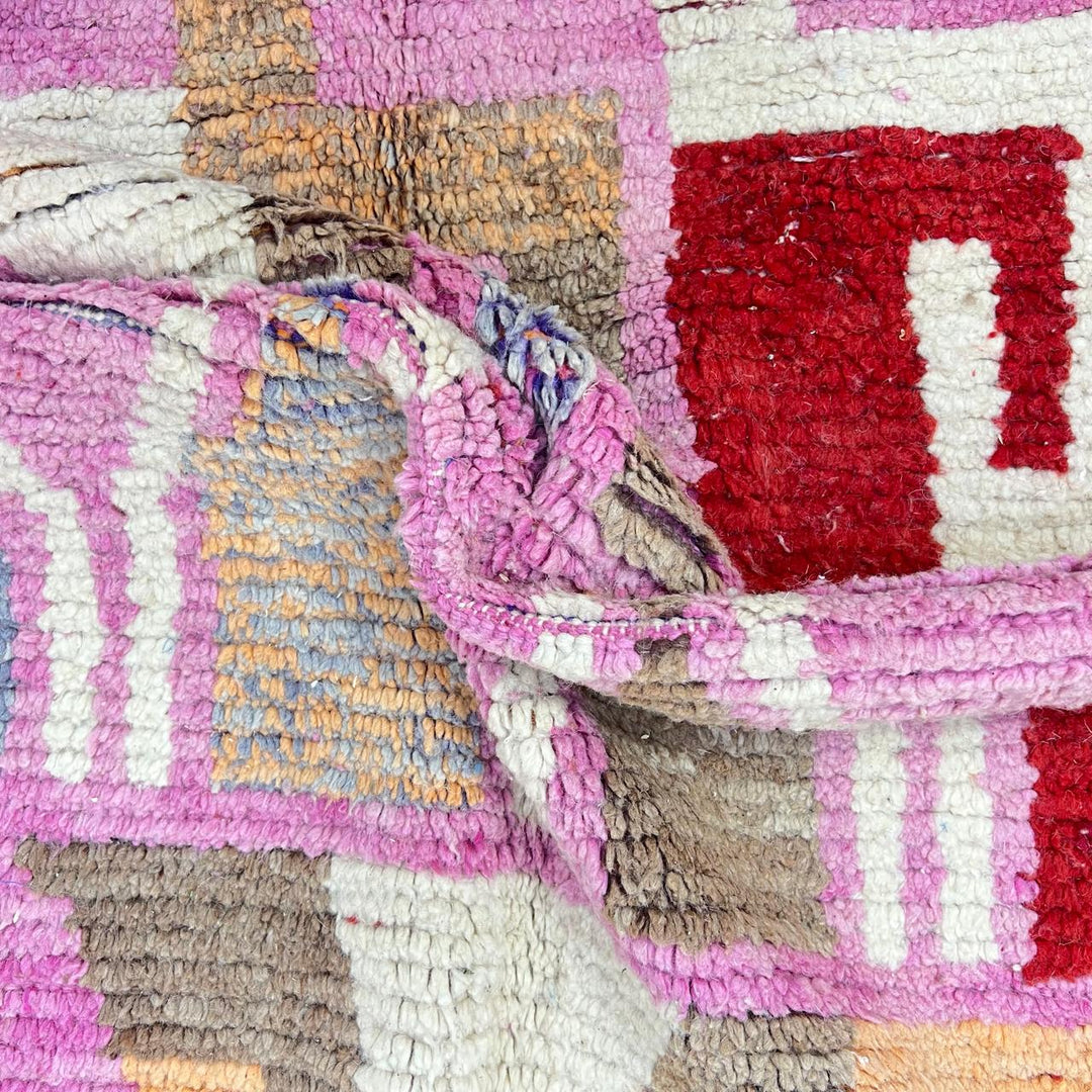 Vintage Moroccan wool rug 776 – colorful handmade Berber carpet with pink, red, and beige geometric patterns, 262 × 168 cm (8.59 × 5.51 ft).