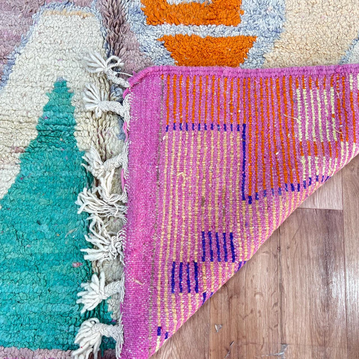 Vintage Moroccan wool rug in pink and orange tones with abstract Berber geometric patterns, handmade in Morocco
