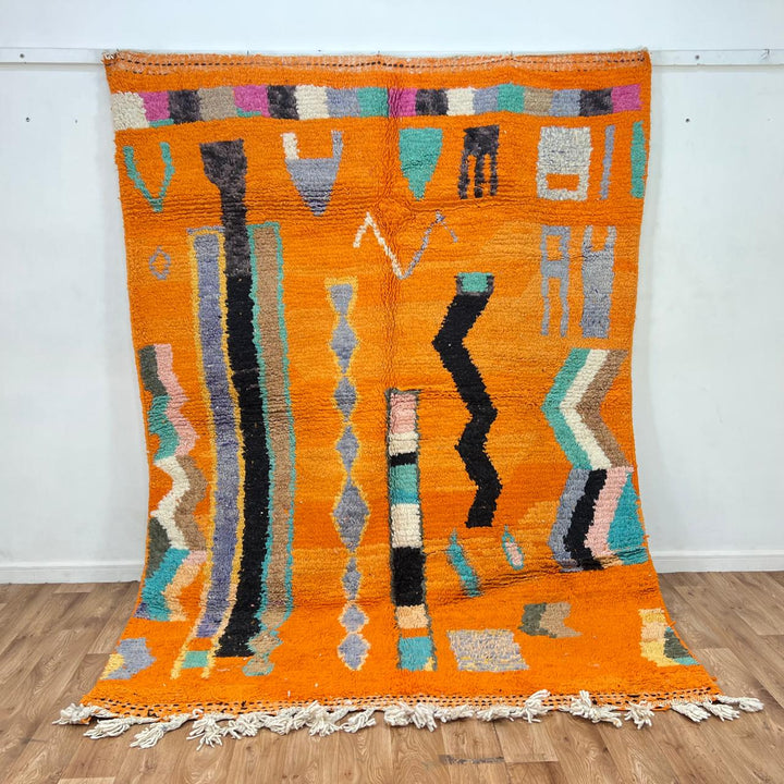 Vintage Moroccan wool rug 324 – handmade Berber carpet with bright orange base and multicolor geometric tribal design, 260 × 190 cm (8.53 × 6.23 ft).