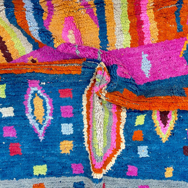 Vintage Moroccan wool rug 138 – handmade colorful geometric Berber design with pink, blue, and orange tones (234 × 162 cm).
