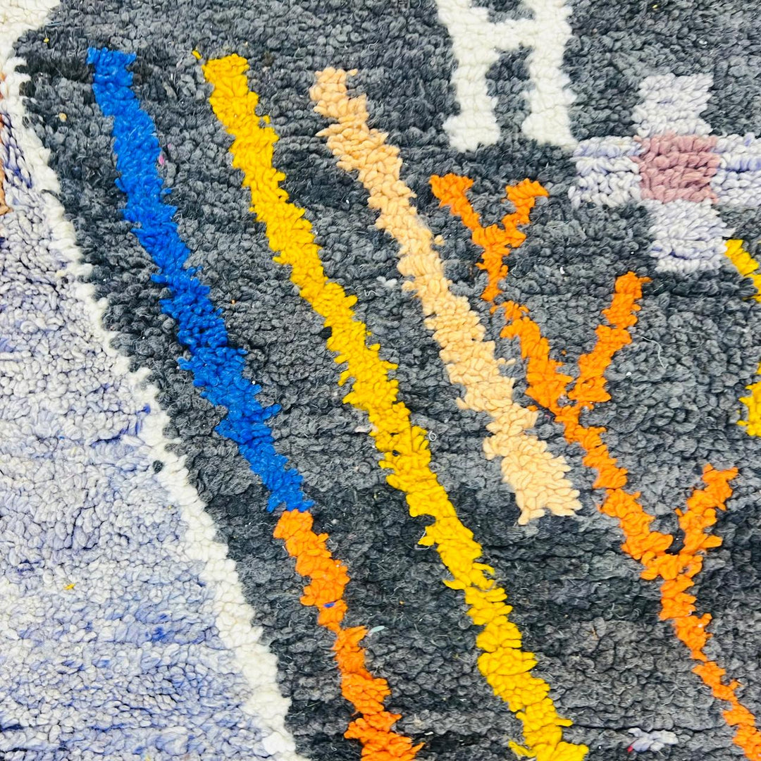 Vintage Moroccan wool rug with abstract geometric Berber design in mustard yellow, blue, and black, handmade in Morocco