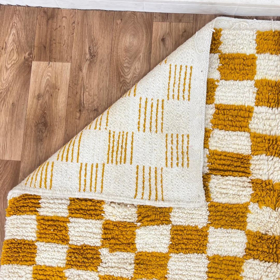 Vintage Moroccan Wool Rug 133 – handmade mustard and cream checkerboard Moroccan wool rug (240 × 172 cm).