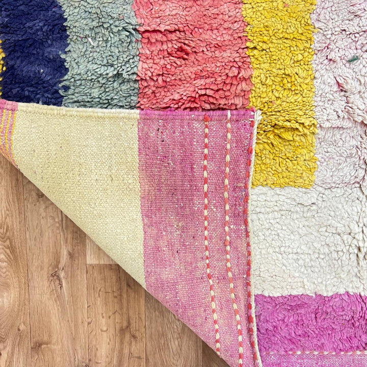 Vintage Moroccan wool rug 925 – handmade Berber carpet with abstract color blocks in pink, yellow, navy, green, and cream (310 × 197 cm / 10.17 × 6.46 ft).
