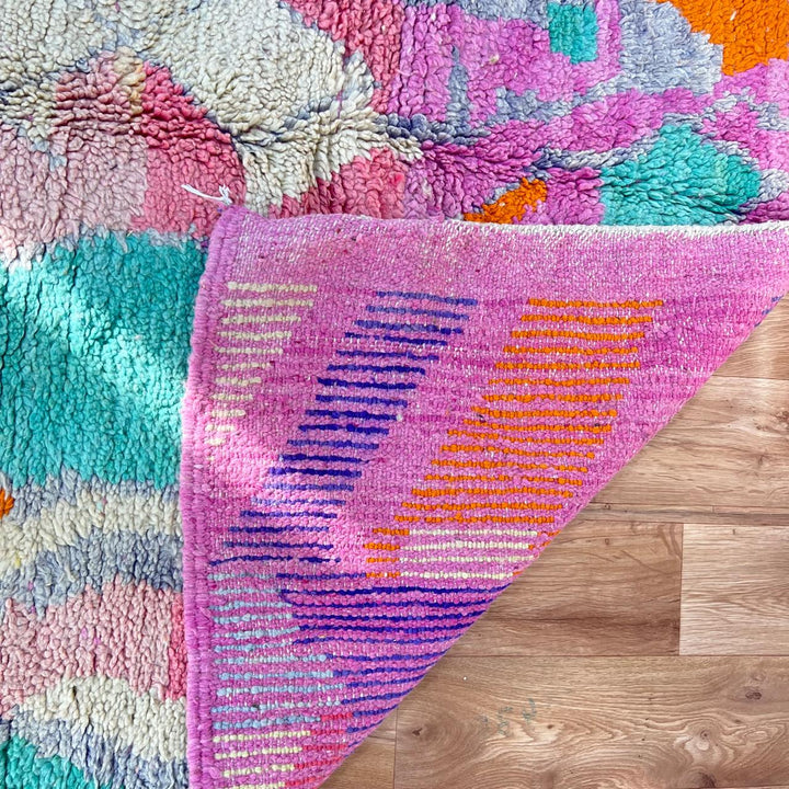 Vintage Moroccan wool rug in pink and orange tones with abstract Berber geometric patterns, handmade in Morocco