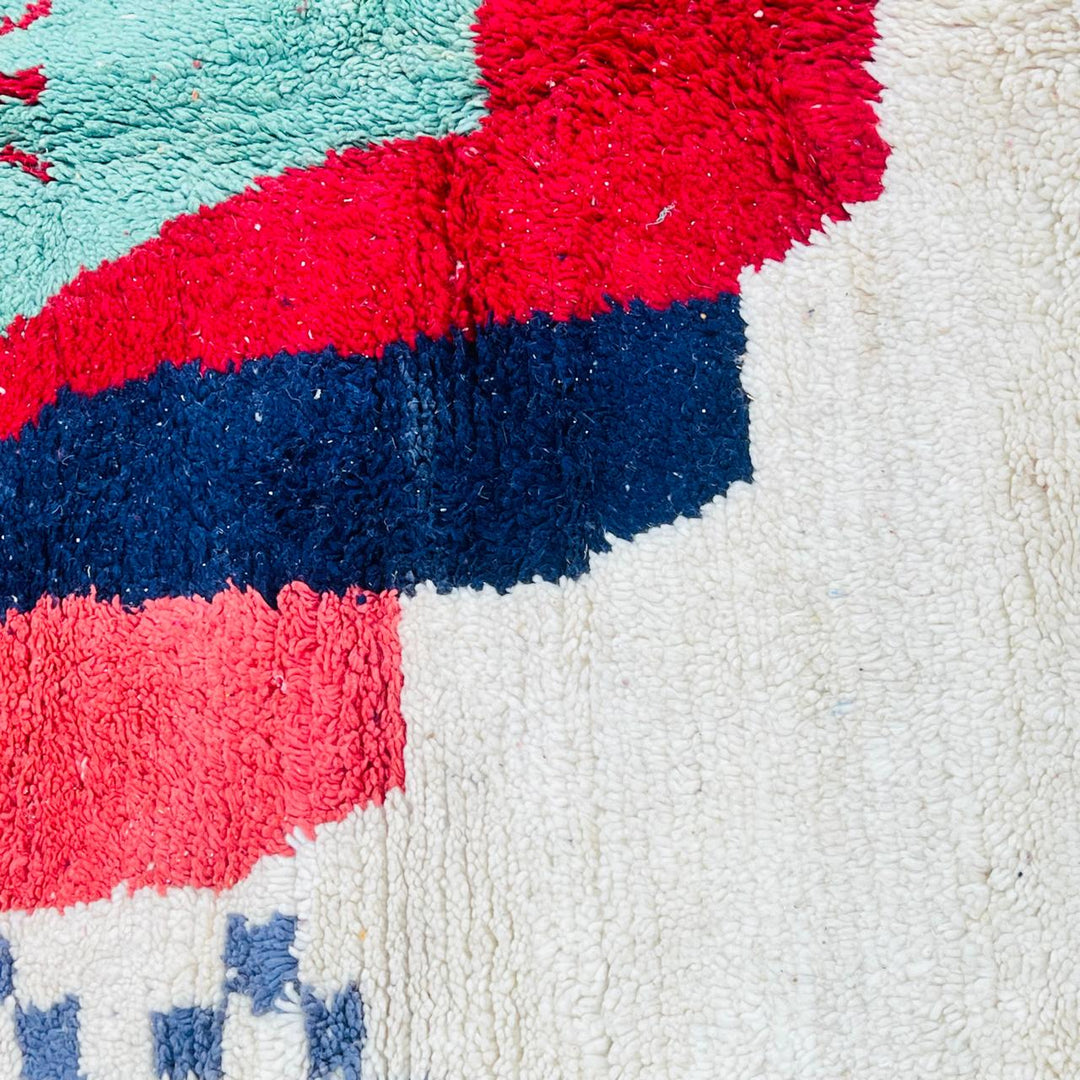 Vintage Moroccan wool rug with bold geometric Berber design in red, navy and mint