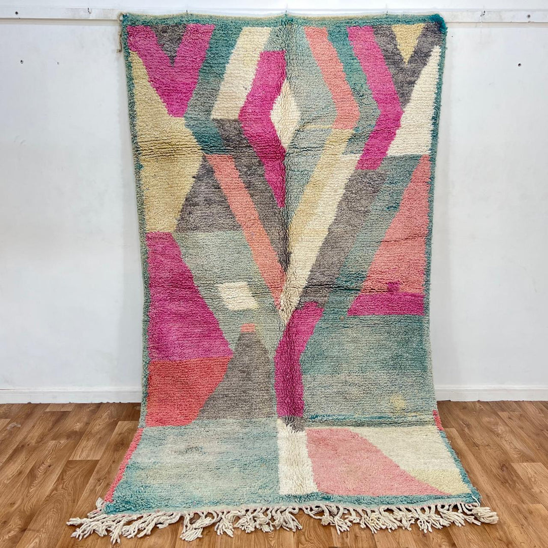 Vintage Moroccan Wool Rug 182 – handmade geometric pastel Moroccan rug in pink, teal, and beige tones (268 × 149 cm).