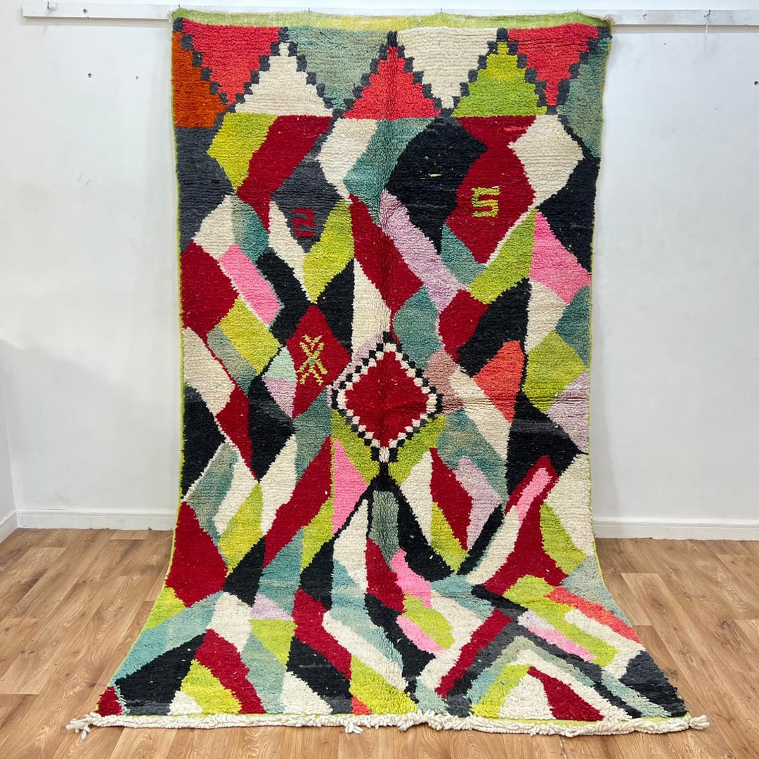 Vintage Moroccan wool rug 210 – handmade colorful geometric Berber design in red, green, pink, and cream (282 × 158 cm).