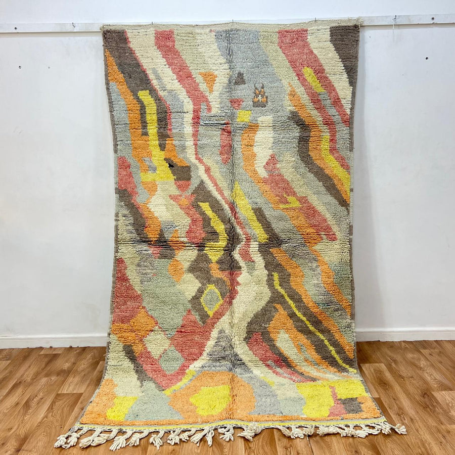 Vintage Moroccan wool rug 396 – handmade abstract earth tone design with yellow, coral, and beige pattern (256 × 148 cm).