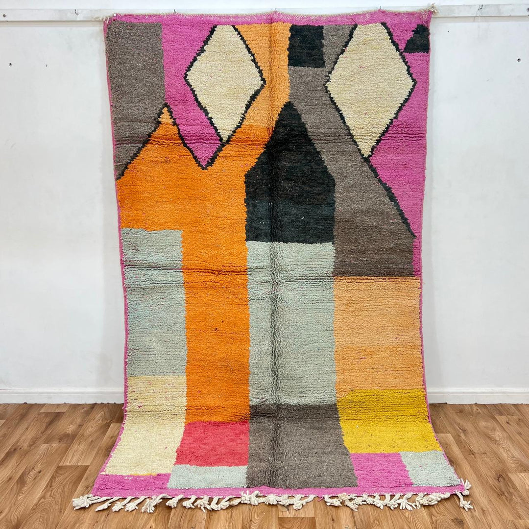 Vintage Moroccan Wool Rug 233 – handmade geometric Berber rug in orange, pink and yellow tones (254 × 154 cm).