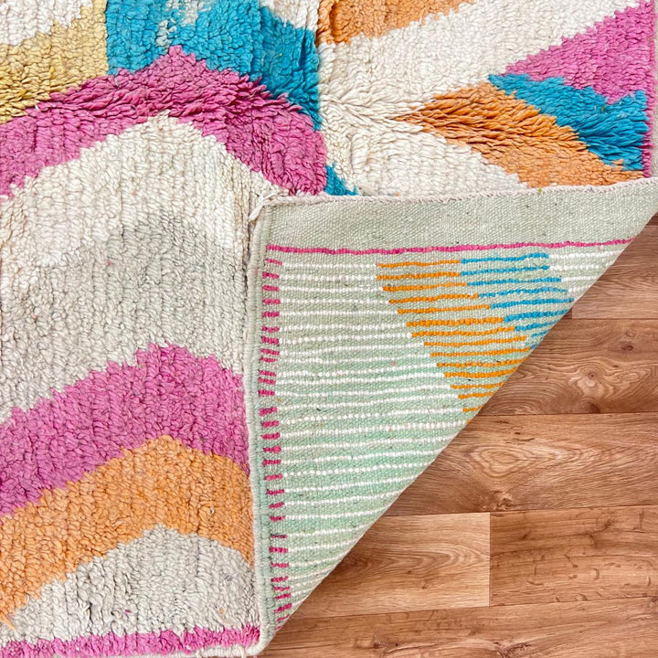 Vintage Moroccan wool rug 781 – handmade Berber carpet with zigzag chevron pattern in pink, orange, cream, and blue. 244 × 151 cm (8.01 × 4.95 ft).
