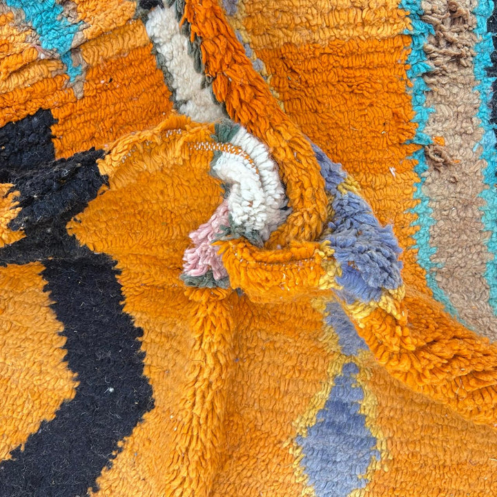 Vintage Moroccan wool rug 324 – handmade Berber carpet with bright orange base and multicolor geometric tribal design, 260 × 190 cm (8.53 × 6.23 ft).