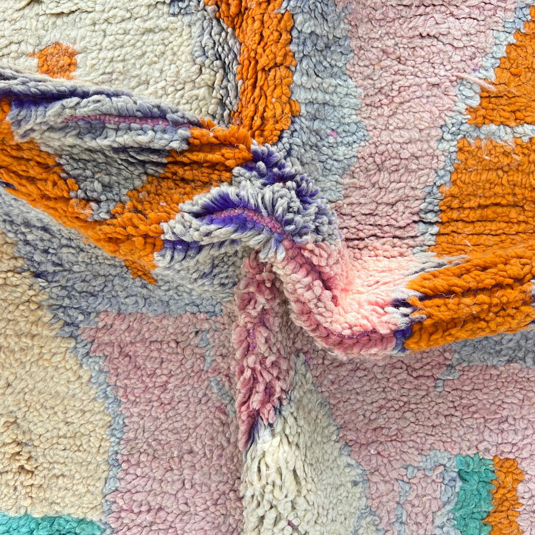 Vintage Moroccan wool rug in pink and orange tones with abstract Berber geometric patterns, handmade in Morocco