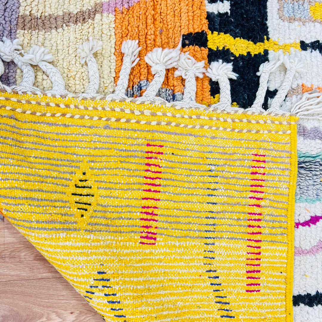 Vintage Moroccan wool rug with colorful Berber geometric symbols, handmade in Morocco