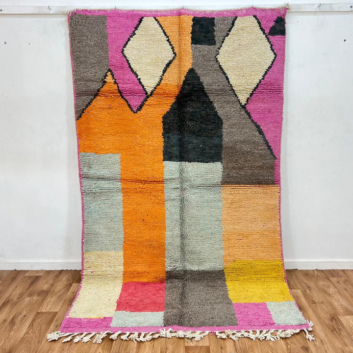 Vintage Moroccan Wool Rug 233 – handmade geometric Berber rug in orange, pink and yellow tones (254 × 154 cm).