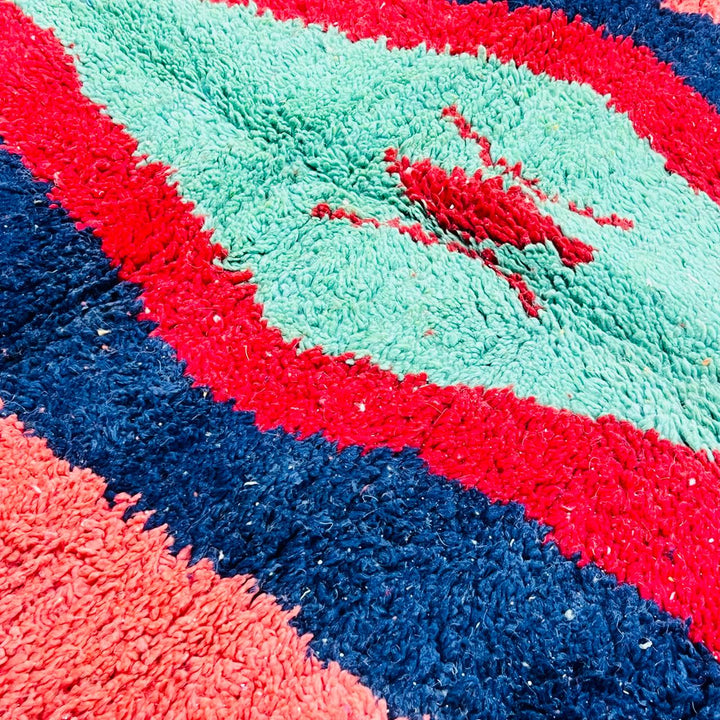 Vintage Moroccan wool rug with bold geometric Berber design in red, navy and mint