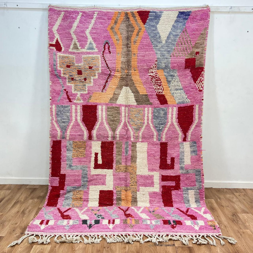 Vintage Moroccan wool rug 776 – colorful handmade Berber carpet with pink, red, and beige geometric patterns, 262 × 168 cm (8.59 × 5.51 ft).