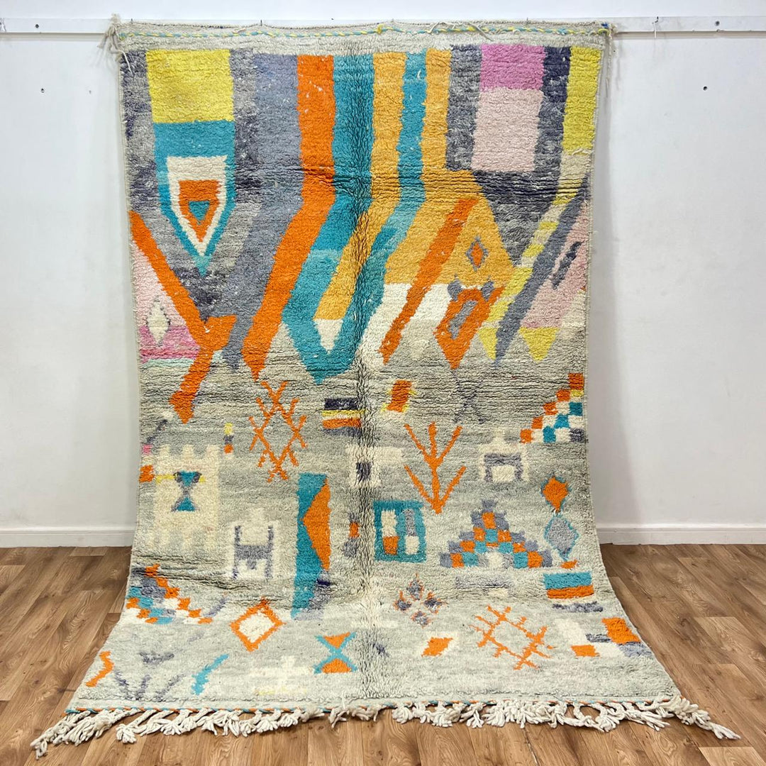 Vintage Moroccan wool rug 782 – cream and colorful handmade Berber carpet with geometric orange, turquoise, and grey patterns, 271 × 170 cm (8.89 × 5.57 ft).