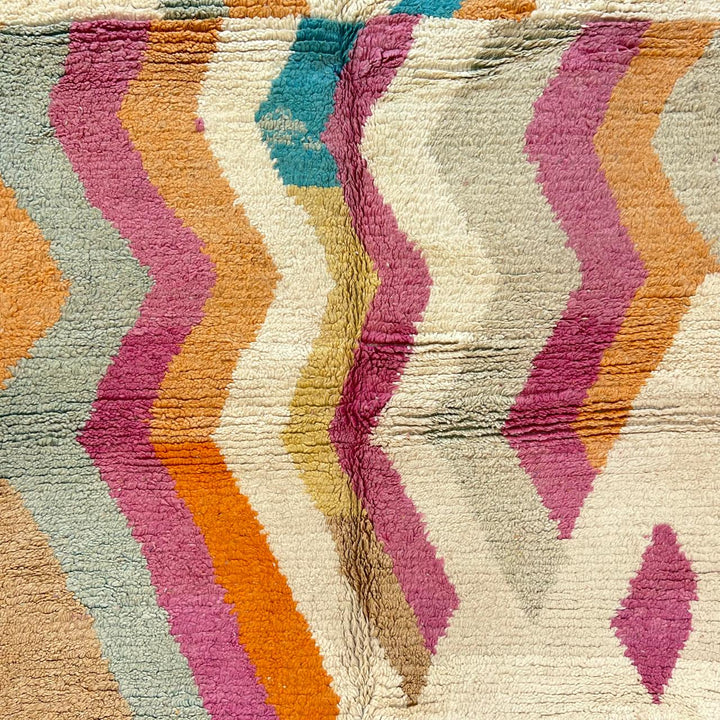 Vintage Moroccan wool rug 781 – handmade Berber carpet with zigzag chevron pattern in pink, orange, cream, and blue. 244 × 151 cm (8.01 × 4.95 ft).