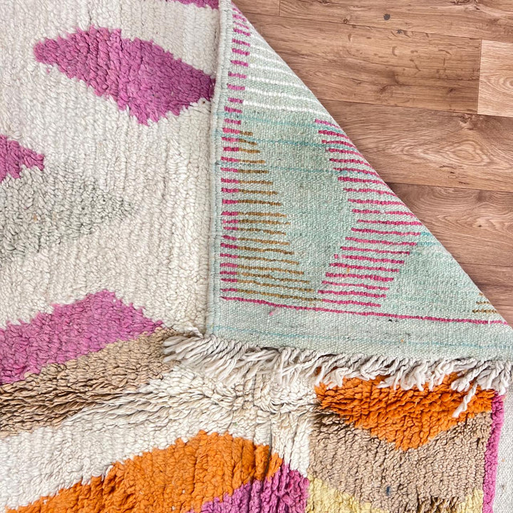 Vintage Moroccan wool rug 781 – handmade Berber carpet with zigzag chevron pattern in pink, orange, cream, and blue. 244 × 151 cm (8.01 × 4.95 ft).