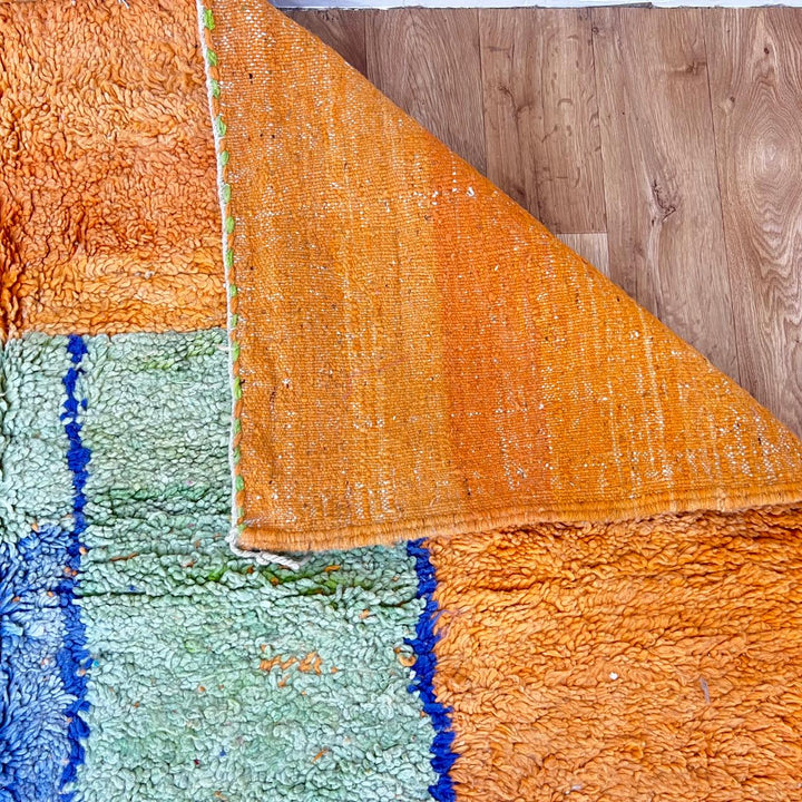 Vintage Moroccan wool rug 826 – handmade Berber carpet with orange, blue, and green geometric abstract design. 308 × 195 cm (10.1 × 6.39 ft).
