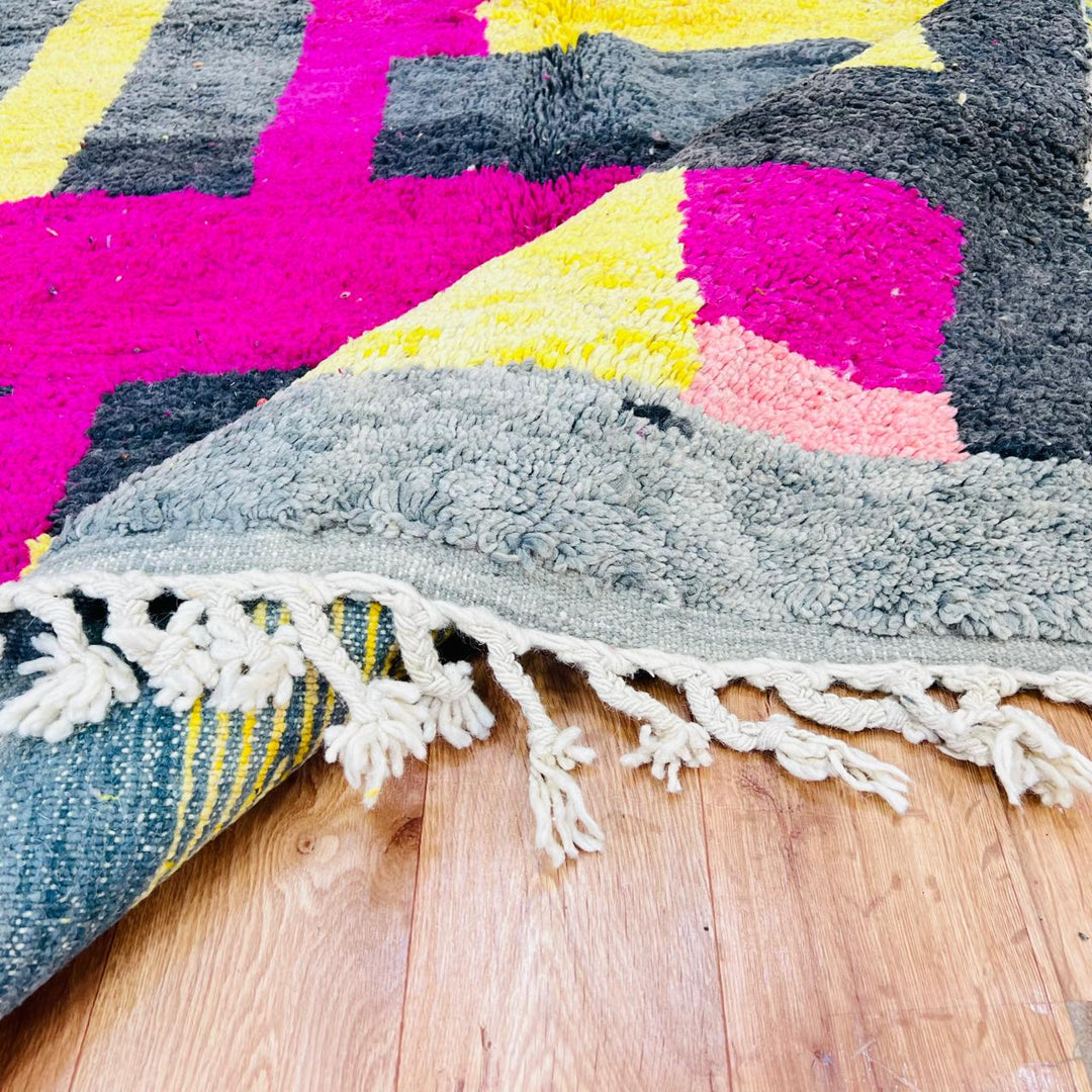 Vintage Moroccan wool rug with pink yellow and charcoal geometric pattern, handwoven Berber carpet from Morocco