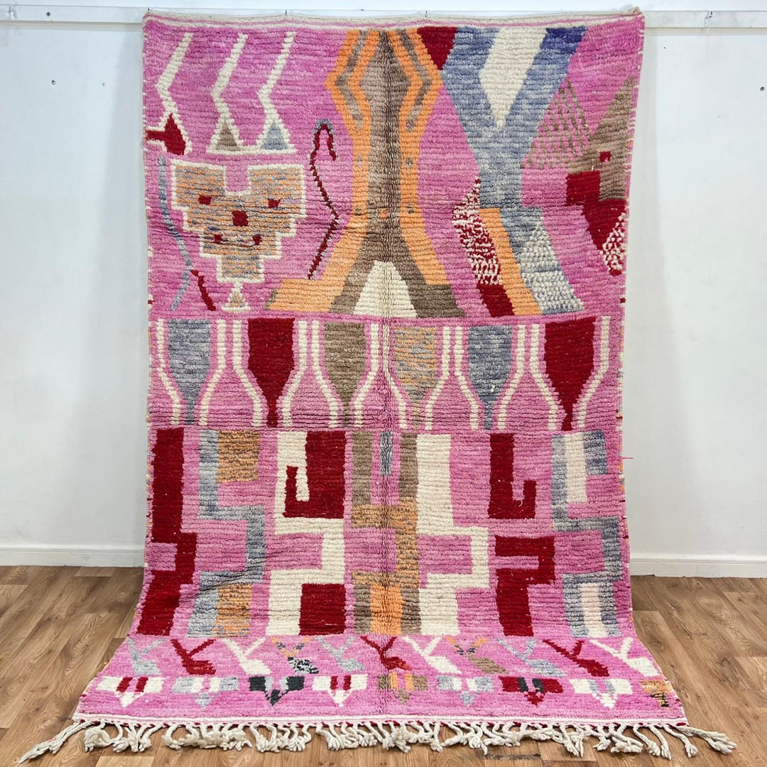 Vintage Moroccan wool rug 776 – colorful handmade Berber carpet with pink, red, and beige geometric patterns, 262 × 168 cm (8.59 × 5.51 ft).