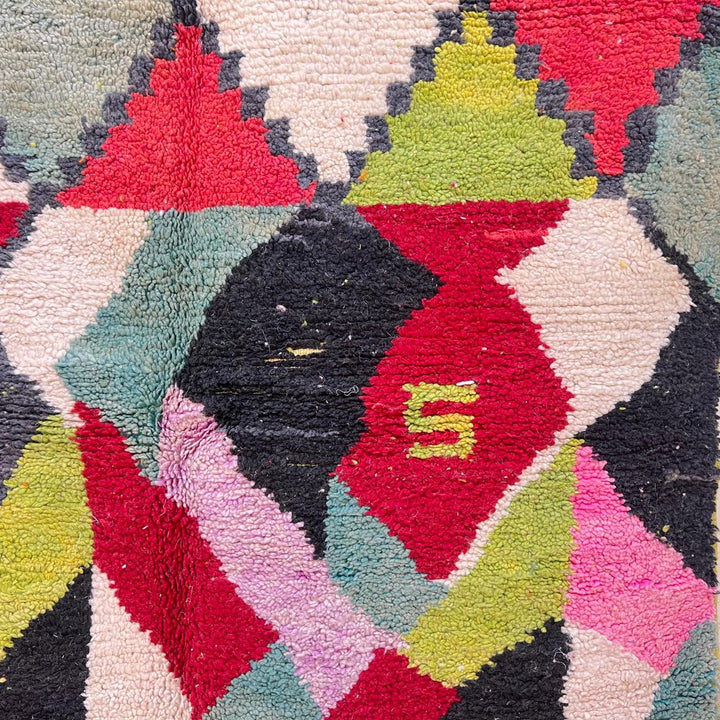 Vintage Moroccan wool rug 210 – handmade colorful geometric Berber design in red, green, pink, and cream (282 × 158 cm).