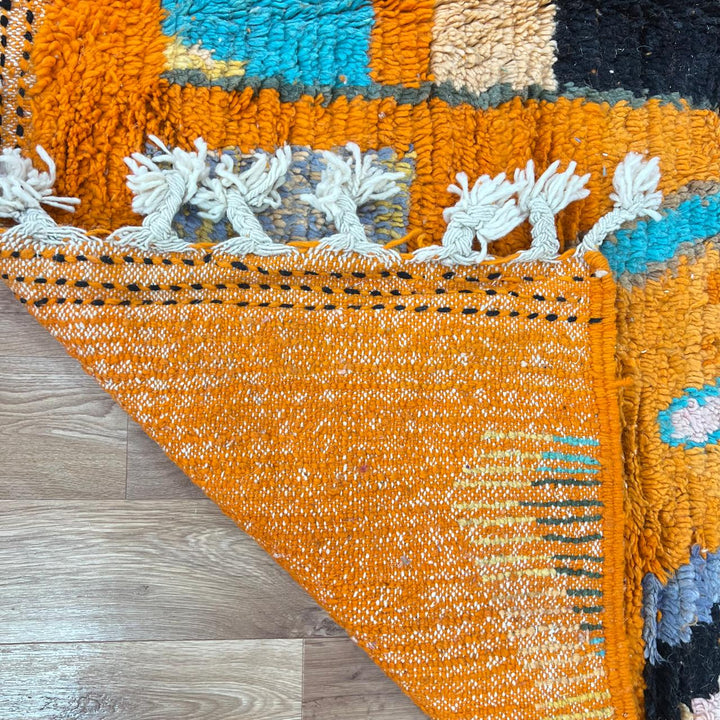 Vintage Moroccan wool rug 324 – handmade Berber carpet with bright orange base and multicolor geometric tribal design, 260 × 190 cm (8.53 × 6.23 ft).