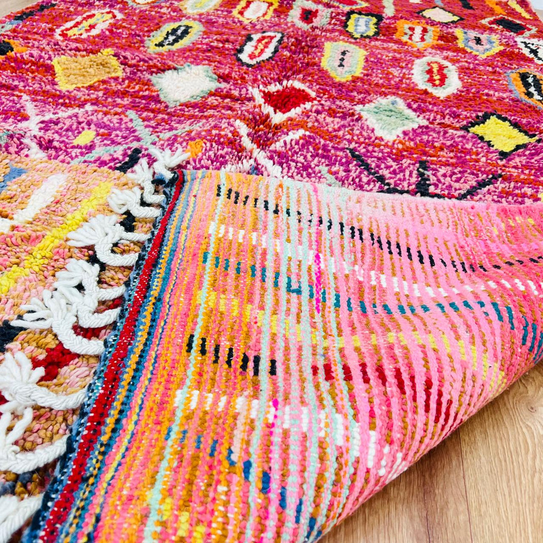 Vintage Moroccan wool rug with red base, colorful Berber diamond patterns, handmade tribal carpet