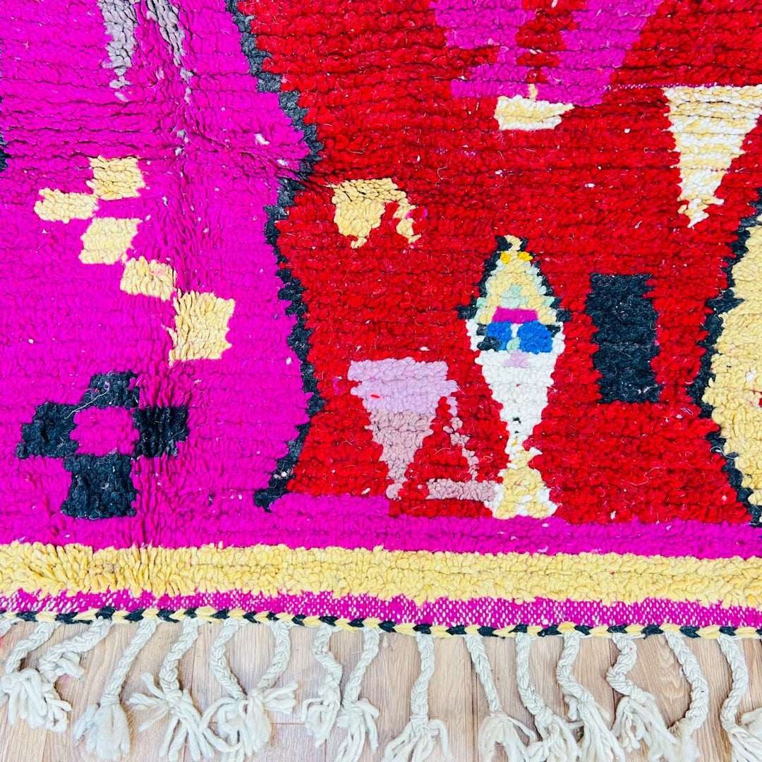 Vintage Moroccan rug with colorful Berber geometric patterns in pink, yellow, blue and red, handmade wool carpet from Morocco