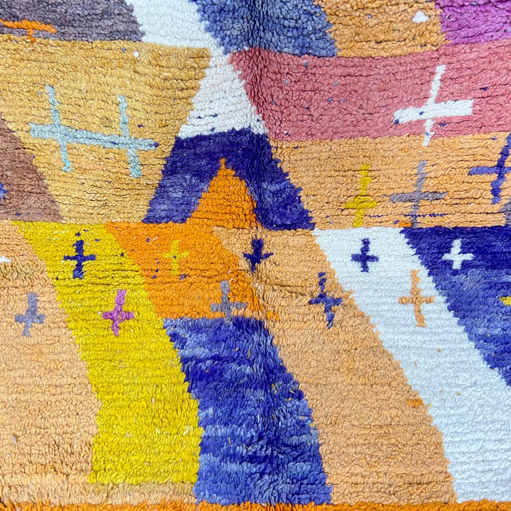 Vintage Moroccan wool rug 257 – handmade Berber rug with vibrant geometric design in orange, yellow, purple, and blue (264 × 162 cm).