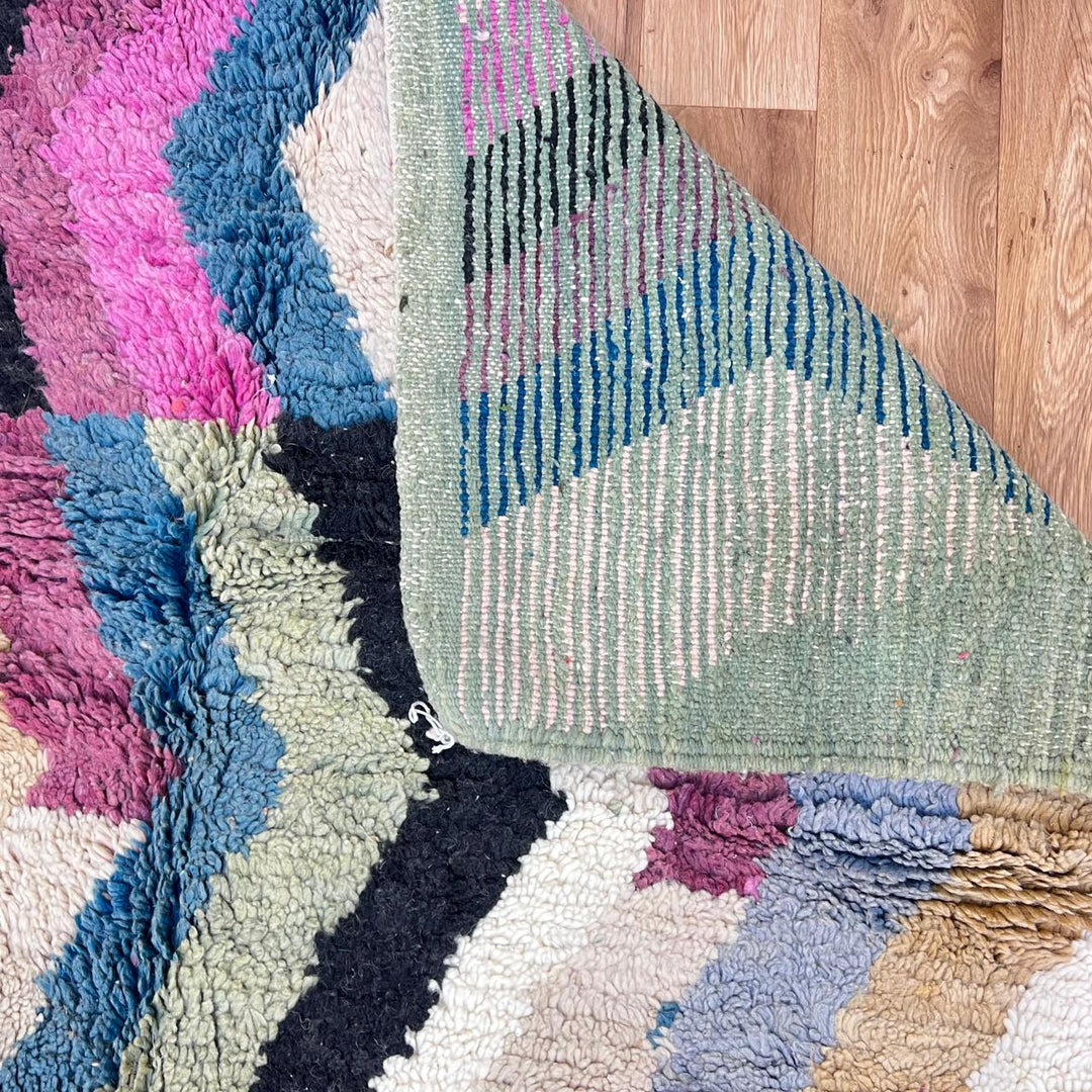 Vintage Moroccan wool rug 773 – colorful handmade Berber carpet with zigzag chevron patterns in blue, pink, yellow, and cream, 264 × 164 cm (8.66 × 5.38 ft).