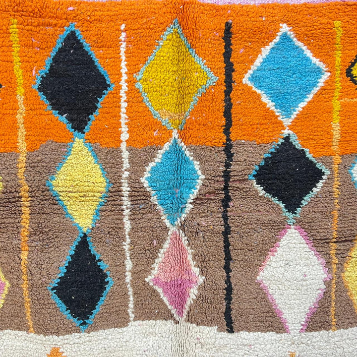 Vintage Moroccan wool rug 251 – handmade colorful geometric Berber rug with orange, turquoise, and yellow diamonds (252 × 150 cm).