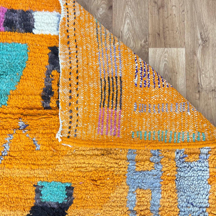 Vintage Moroccan wool rug 324 – handmade Berber carpet with bright orange base and multicolor geometric tribal design, 260 × 190 cm (8.53 × 6.23 ft).
