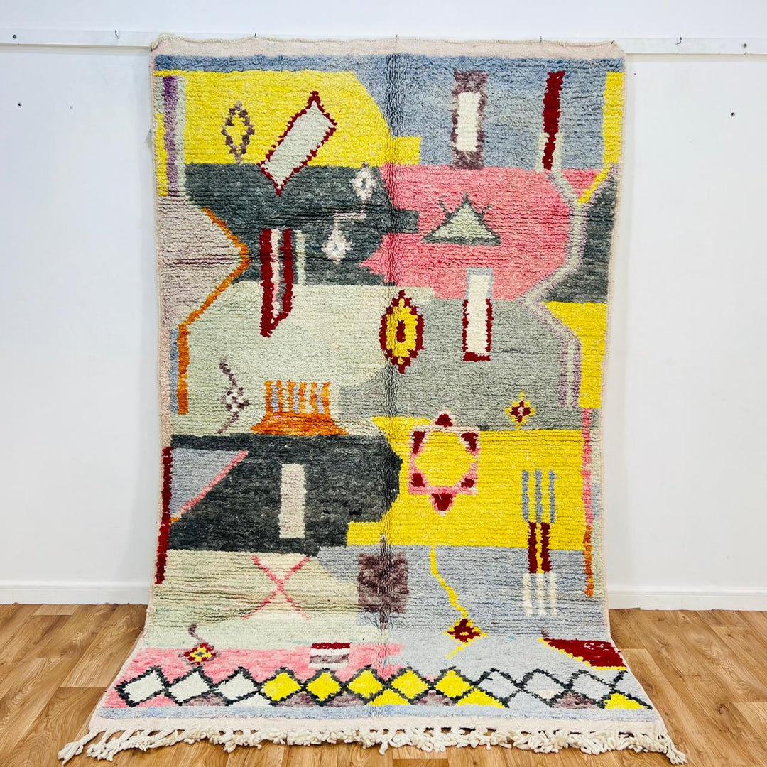 Vintage Moroccan wool rug with colorful abstract Berber geometric patterns in grey, pink, yellow and ivory, handmade in Morocco, 257x158 cm