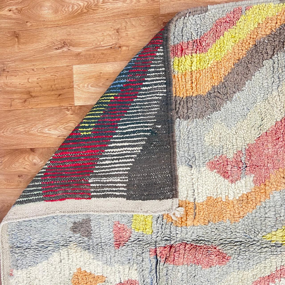 Vintage Moroccan wool rug 396 – handmade abstract earth tone design with yellow, coral, and beige pattern (256 × 148 cm).