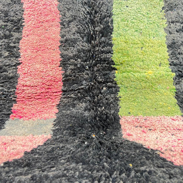 Vintage Moroccan wool rug 731 – handmade Berber carpet with black, green, pink, and grey abstract tribal patterns (233 × 147 cm / 7.64 × 4.82 ft).
