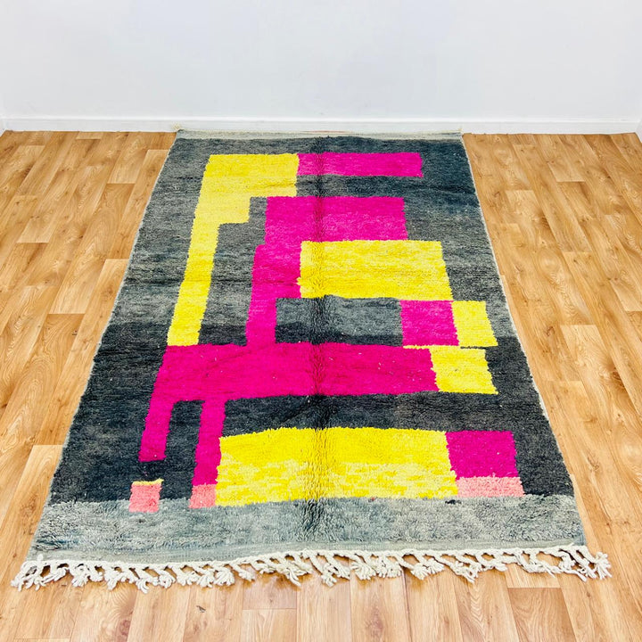 Vintage Moroccan wool rug with pink yellow and charcoal geometric pattern, handwoven Berber carpet from Morocco